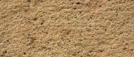 Background of the old wall. Texture of stone surface. Abstract background in retro style. Brown surface of solid material