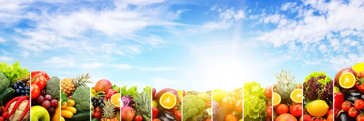 Plexiglas foto achterwand Variety vegetables and fruits against sky © Serghei V