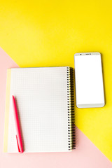 Creative flat lay photo of workspace desk with smartphone,and notebook with copy space background, minimal style