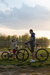 Family bike ride at sunrise