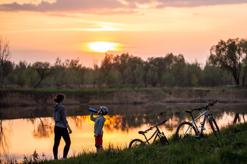 Family bike ride at sunrise