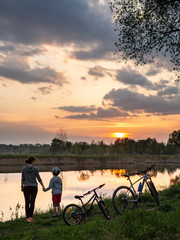 Family bike ride at sunrise