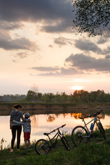 Family bike ride at sunrise