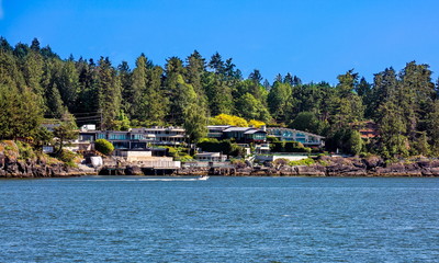 Fototapeta na wymiar The village is on the shore of the bay on the wooded slope of the suburb of West Vancouver. Horseshoe Bay West Vancouver British Columbia, Canada