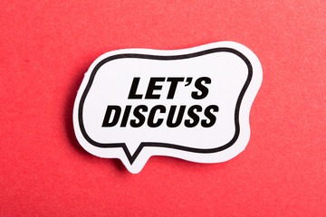 Let Us Discuss Speech Bubble Isolated On Red Background