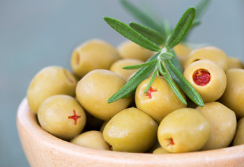 Fresh healthy green olives with rosemary, closeup