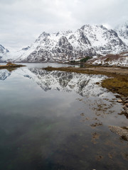 Reflection of mountain on fjord  during winter, Norway