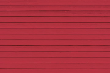 Texture background of wood  plank colored in jester red color , trendy color of spring and summer 2019