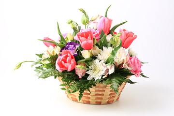 basket of flowers isolated on white background.