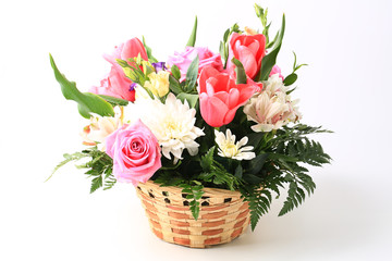 basket of flowers isolated on white background.