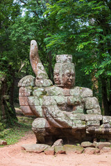 Head sculptures outside the north gate at Angkor Thom temple complex, Siem Reap, Cambodia