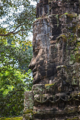 Face details from the beautiful north gate at Angkor Thom temple complex, Siem Reap, Cambodia