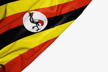 Uganda flag of fabric with copyspace for your text on white background.