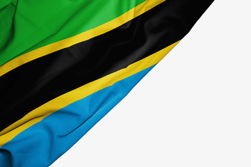 Tanzanian flag of fabric with copyspace for your text on white background.
