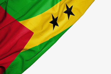 Sao Tome and Principe flag of fabric with copyspace for your text on white background.