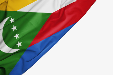 Comoros flag of fabric with copyspace for your text on white background.