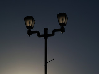 Fototapeta na wymiar street lamp on a blue sky background
