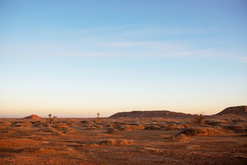Fototapeta na wymiar Golden deserts and hills at sunrise.