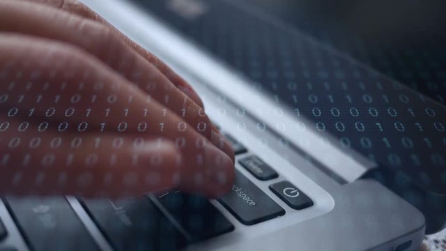 Finger dramatically presses the backspace button on laptop with binary overlay