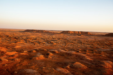 Golden deserts and hills at sunrise.