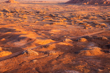 Golden deserts and hills at sunrise.