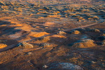 Golden deserts and hills at sunrise.