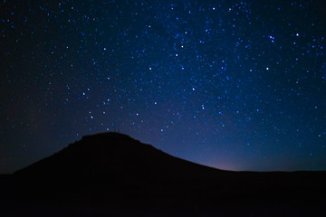 The beautiful sky is shining with stars at night.