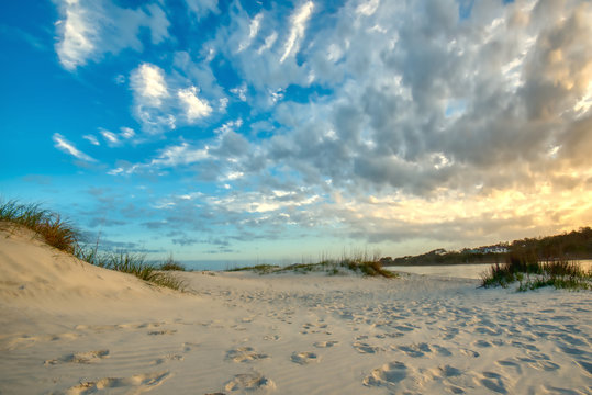 Puffy white clouds over the beach in Pawleys Island, SC.