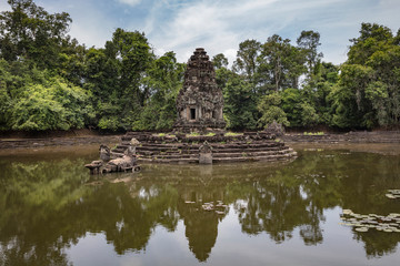 Fototapeta na wymiar Jayatataka Baray, a man made lake which contains the Neak Pean artificial island with a Buddhist temple on a circular island at Angkor, Siem Reap, Cambodia