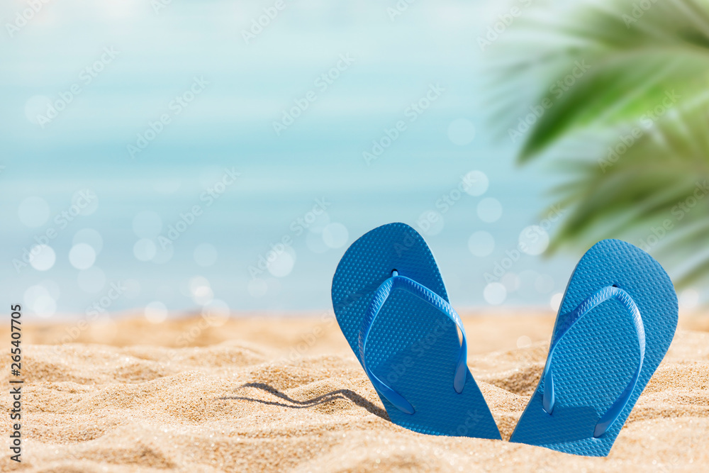 Poster flip flops on the sunny tropical beach with palm trees and turquoise water, Caribbean island vacation, hot summer day