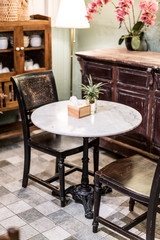 Fototapeta na wymiar vintage table and chair in cafe restaurant