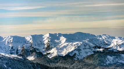 Awesome view of the Caucasus mountains covered by snow in the ski resort of Krasnaya Polyana, Russia.