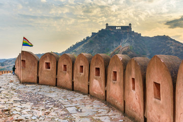 Ancient long wall with towers around Amber Fort, and view of Jaigarh Fort. Rajasthan. India