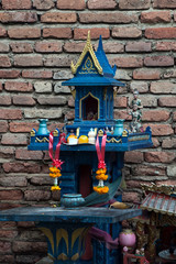 Chiang Mai Thailand, spirit house placed near the wall surrounding the old city