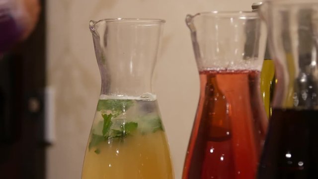 Bottles of juices and drinks close up slow