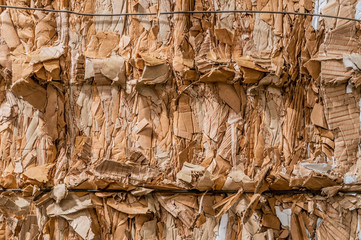 Pile of pressed corrugated cardboards ready for recycling