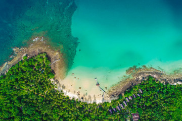 Fototapeta na wymiar Aerial view white sand beach with coconut palm tree turquoise water