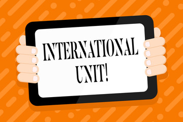 Conceptual hand writing showing International Unit. Concept meaning the internationally accepted amount of a substance Color Tablet Smartphone with Screen Handheld Back of Gadget