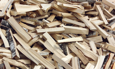 lot of split logs of hardwood. birch firewood.