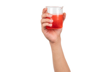 Science beaker with red water or red liquid holding by boy hand isolated on white background. Hand showing science beaker in laboratory.