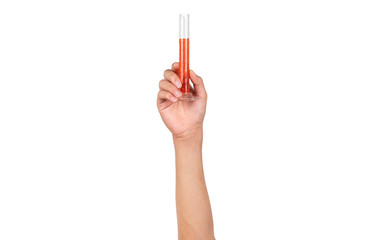 Glass cylinder measurement or graduated glass cylinder with red water or red liquid holding by boy hand isolated on white background. Hand showing science measurement tool in laboratory.
