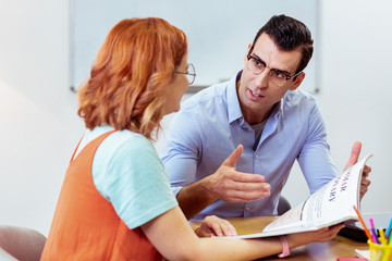 Obraz premium Smart young man having a private lesson