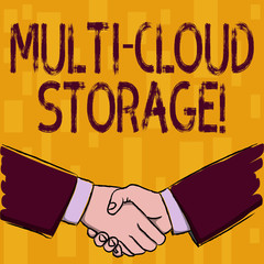 Writing note showing Multi Cloud Storage. Business concept for use of multiple cloud computing and storage services Businessmen Shaking Hands Form of Greeting and Agreement