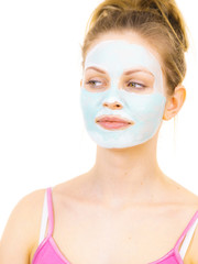 Girl with green mud mask on face