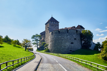 Fototapeta na wymiar Big stone castle in Vaduz in Liechtenstein on a summer day and blue sky