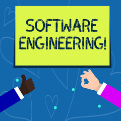 Conceptual hand writing showing Software Engineering. Concept meaning apply engineering to the development of software Two Businessmen Hands Gesturing the Thumbs Up and Okay Sign
