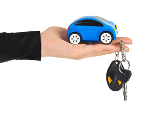 Hand with keys and car