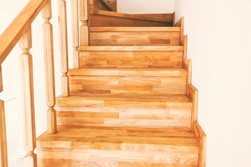 Fototapeta na wymiar Contemporary brown wooden stairs in the house