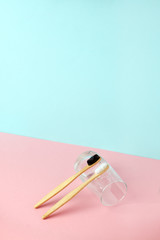 Bamboo teeth brush on minimalistic backgroud. zero waste concept, 3d rendering imitation...
