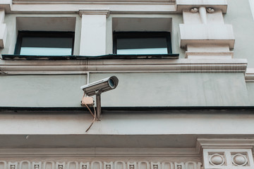 Closeup of security camera on vintage building